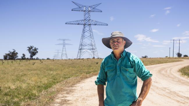 Mr Petersen’s neighbour Richard Carn who is in a similar position; the line of towers on Mr Carn’s property. Picture: Ash Smith