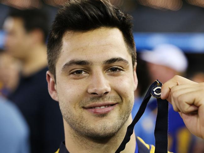 Michael Gibbons shows off his medal as best-afield in the 2016 VFL grand final. Picture: Getty Images