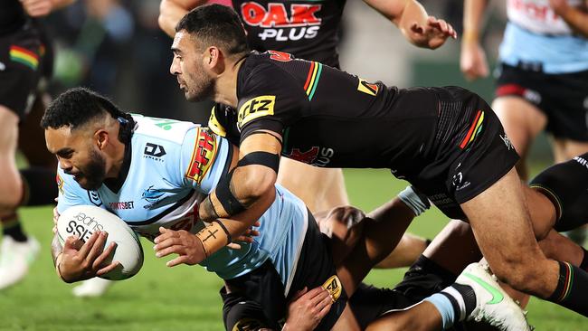 SYDNEY, AUSTRALIA - JUNE 11:  Siosifa Talakai of the Sharks is tackled during the round 14 NRL match between the Cronulla Sharks and the Penrith Panthers at Netstrata Jubilee Stadium, on June 11, 2021, in Sydney, Australia. (Photo by Mark Kolbe/Getty Images)