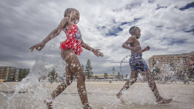 Hot Weather at Glenelg. Cooling off are Hlompho Kabi, 8, and Keamohetswe Tsupa, 10. Picture Brett Hartwig