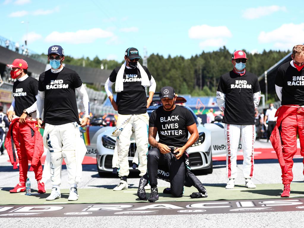 Lewis Hamilton leads the kneeling.