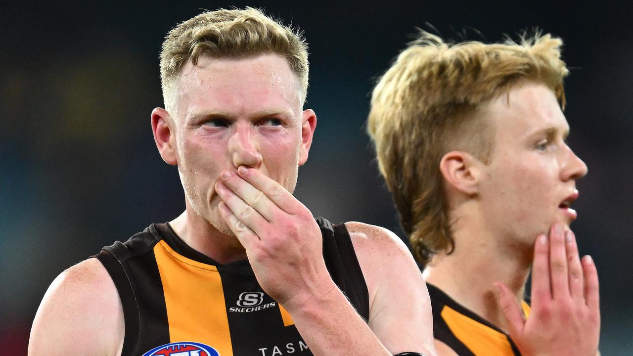 MELBOURNE, AUSTRALIA - MAY 13: James Sicily and Cam Mackenzie of the Hawks look dejected after losing the round nine AFL match between Hawthorn Hawks and Melbourne Demons at Melbourne Cricket Ground, on May 13, 2023, in Melbourne, Australia. (Photo by Quinn Rooney/Getty Images)