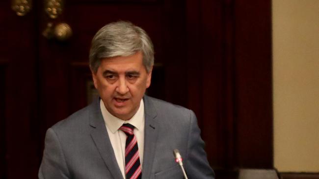 SA Treasurer Rob Lucas hands down his 2019/20 Budget papers at Parliament House in Adelaide, Tuesday, June 18, 2019. (AAP Image/Kelly Barnes) NO ARCHIVING