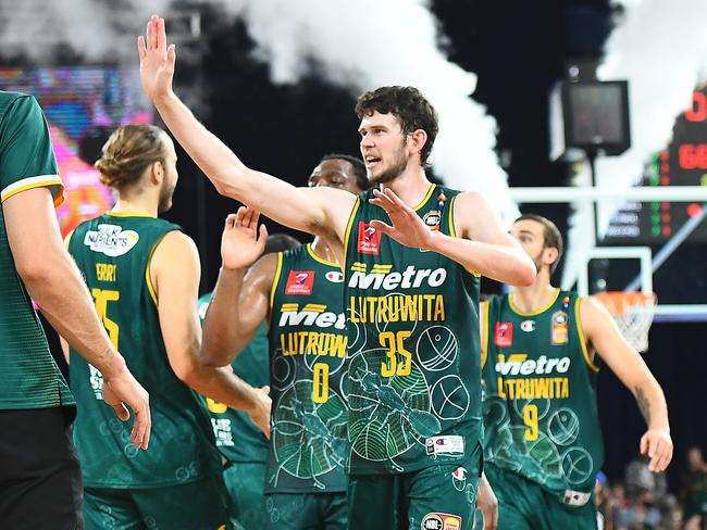 Clint Steindl of the JackJumpers celebrates with teammates during the round 14 NBL match between Tasmania JackJumpers and New Zealand Breakers at the Silverdome on March 05, 2022, in Launceston, Australia. Picture: Steve Bell/Getty Images