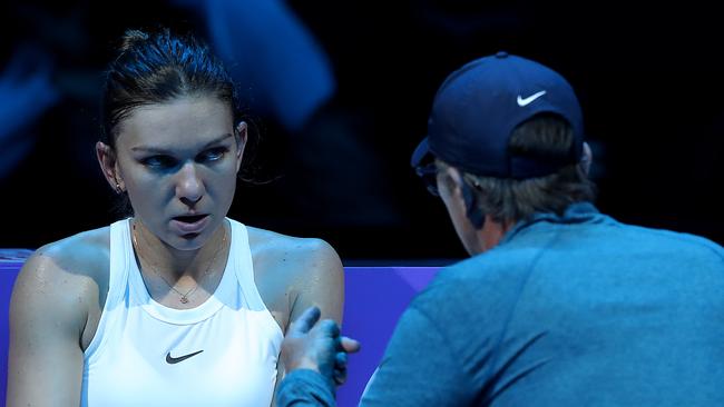 Simona Halep (L) of Romania speaks to her coach Darren Cahill during a break in her Women's Singles match against Karolina Pliskova of the Czech Republic on Day Six of the 2019 Shiseido WTA Finals. Cahill has come under fire for the language used in his talk. (Photo by Lintao Zhang/Getty Images)