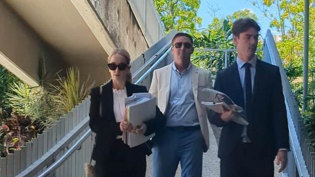 Aaron Danyel Hill (centre), leaves Townsville courthouse after his committal hearing, flanked by his Barrister Claire Grant (left) and assistant (right).