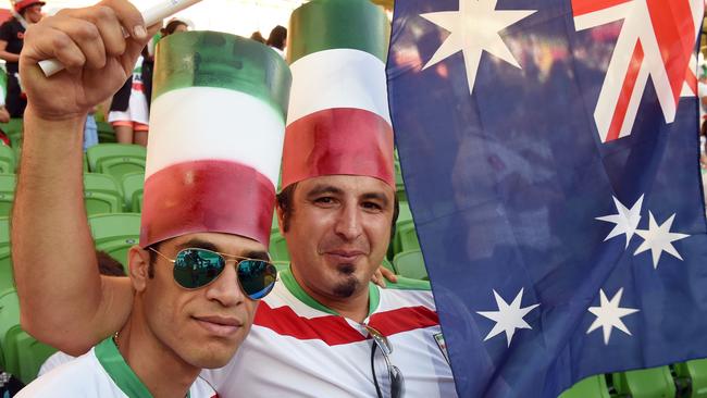 Fans of Iran cheer their team before their match against Bahrain.