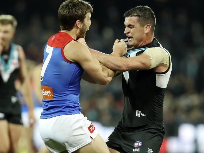 22/06/18 - AFL - Round 14 - Port Adelaide v Melbourne at Adelaide Oval. Former team mates Jack Viney and Tom Rockliff go at it as the half time siren goes. Picture SARAH REED