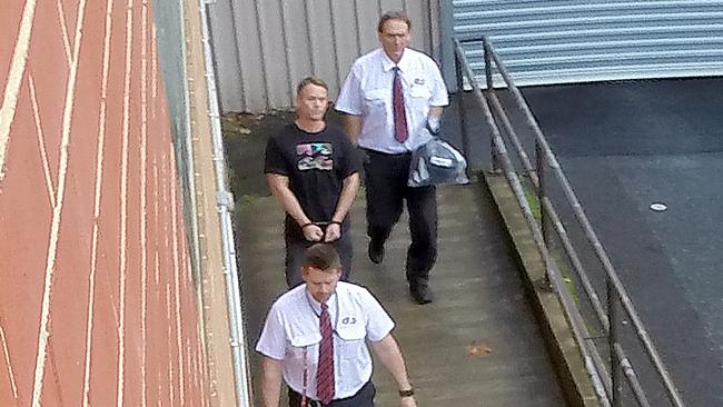 Prison escapee and cop killer Gordon Marshal is escorted into Adelaide Magistrates Court in 2016.