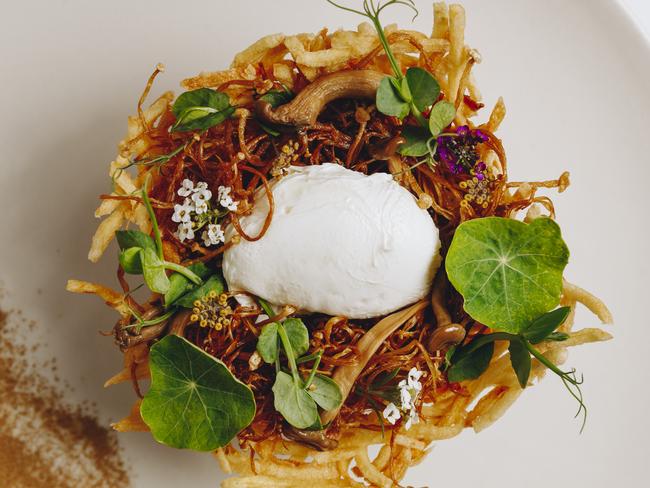 Industry Beans Chadstone. Porcini Nest with porcini dusted egg, potato nest, wild mushroom duxelle and kale. Picture: Supplied.