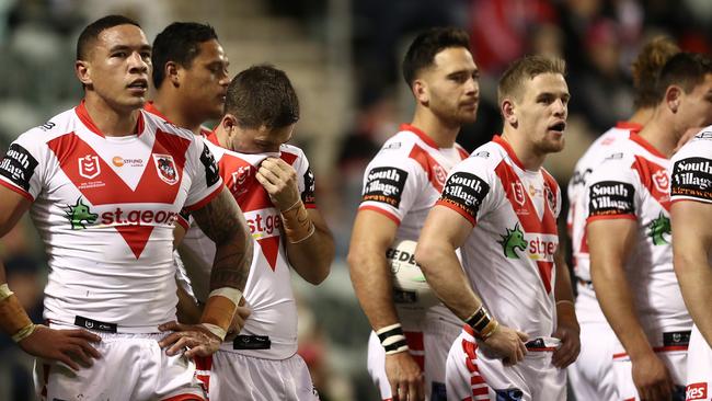 Dragons players look dejected after conceding a try to the Raiders. Picture: Getty Images