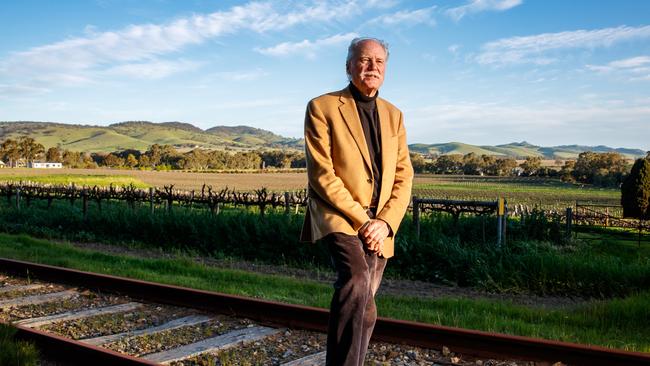 John Geber on the railway tracks at Chateau Tanunda. Mr Geber wants to bring back the Barossa wine train. Picture: Matt Turner