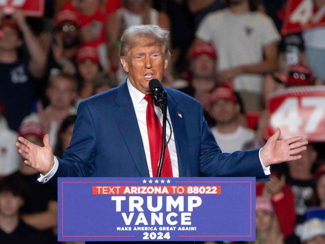 (FILES) Former US President and Republican presidential candidate Donald Trump speaks during a campaign rally at Mullet Arena in Tempe, Arizona on October 24, 2024. Donald Trump won the state of Arizona in this week's US presidential election, US TV networks projected on November 9, 2024, completing the Republican's sweep of all seven swing states. (Photo by Rebecca NOBLE / AFP)