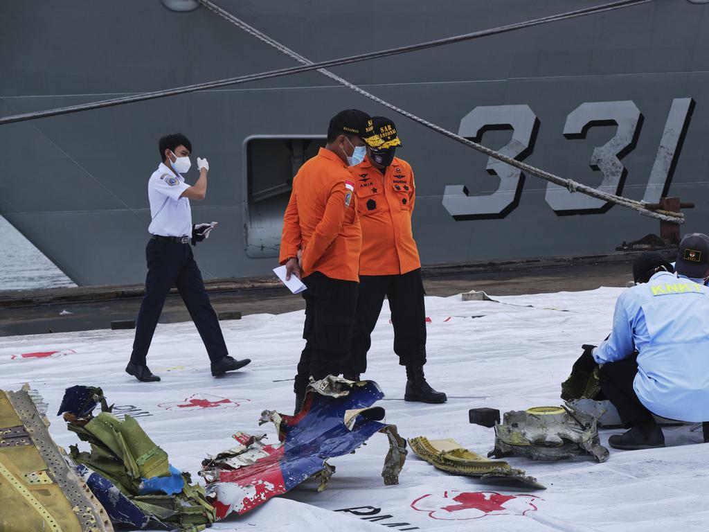 Indonesian investigators examine debris from Sriwijaya Air flight SJ182 on January 10, 2021 in Jakarta, Indonesia. Picture: Getty Images