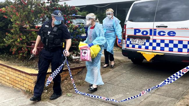 Pathology testing staff leave Adalong Guesthouse in South Brisbane after a guest tested positive. Picture: Sam Scott