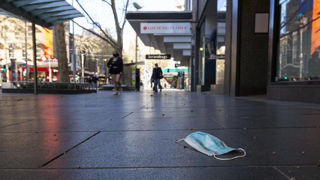 A discarded mask on Swanston Street in Melbourne. Picture: Daniel Pockett