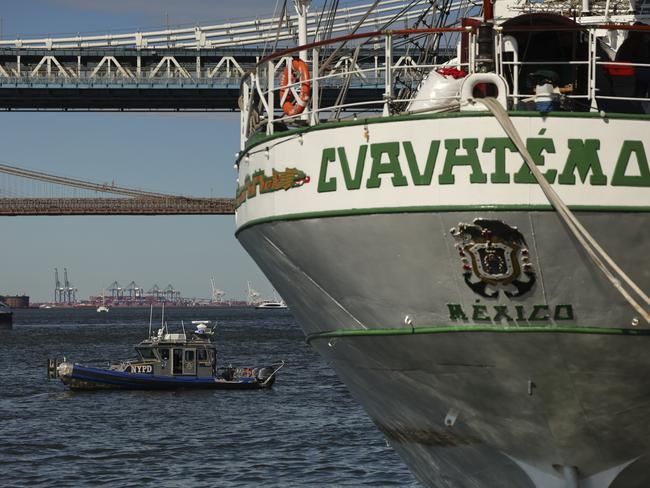 A New York Police harbor vessel patrols the East River around Pier 35, Sunday, May 18, 2025 in New York, where the masted Mexican Navy training ship that collided with the Brooklyn Bridge the night before sits docked. Picture: AP Photo/Yuki Iwamura