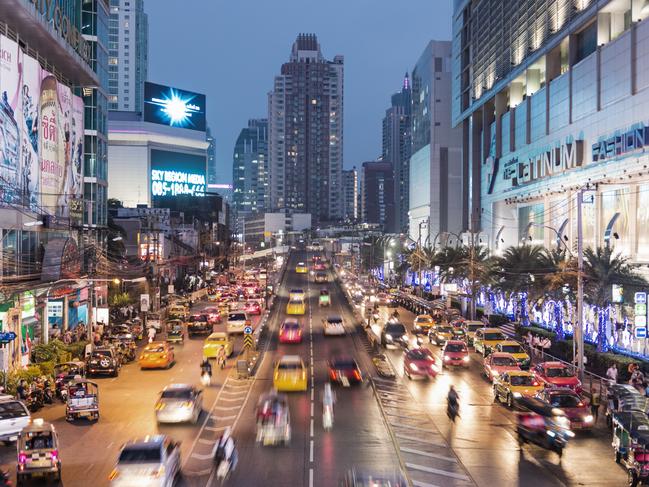 Asia, Thailand, Bangkok, busy road at night, with taxis waiting outside busy shopping complexcredit: Getty Imagesescapedoc holiday 2 january 2022