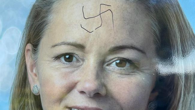A swastika was drawn across the forehead of an image of Ms McKenzie on a poster. Picture: Supplied