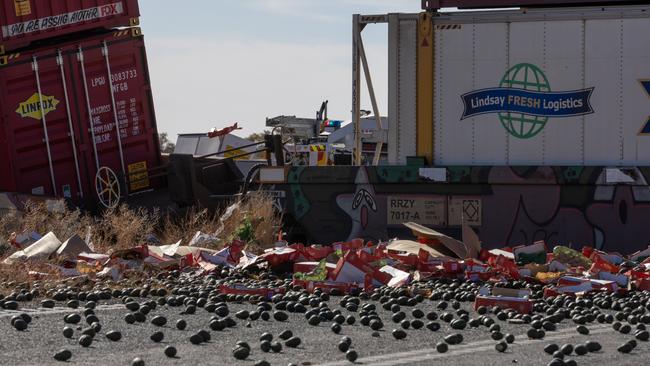 The road remained closed in both directions between Peterborough and the NSW border on Sunday night, and cranes were being sent from Port Augusta to help with the clean-up. Picture: Andrew Gosling