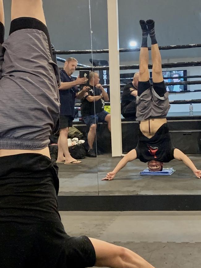 Tszyu preparing for Jeff Horn by standing on his head.