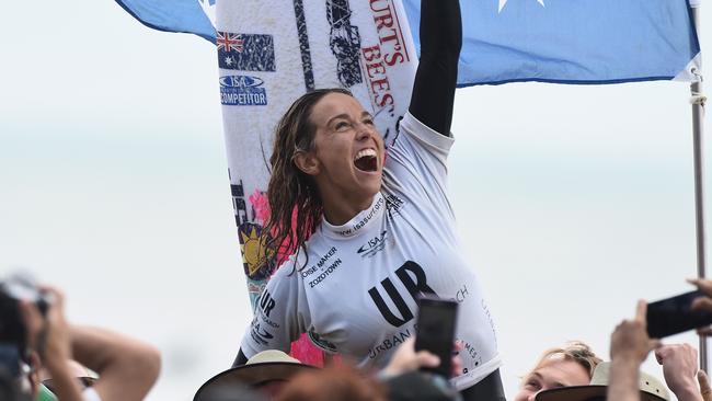 Sally Fitzgibbons celebrates winning the ISA world title before her accident in December.