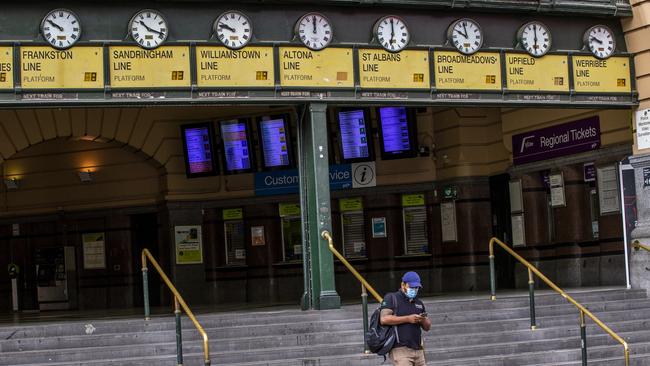 A largely deserted Flinders St Station in Melbourne on day two of lockdown. Picture: Getty