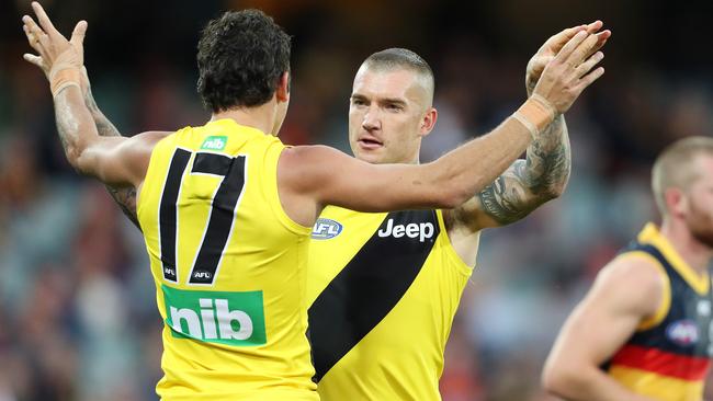 Richmond's Daniel Rioli celebrates his goal with teammate Dustin Martin. Which Rioli will wear the No.17 jumper in 2021? Picture: Sarah Reed