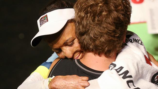 Turia Pitt hugs her partner Michael Hoskin after finish. Pic: Michael Klein