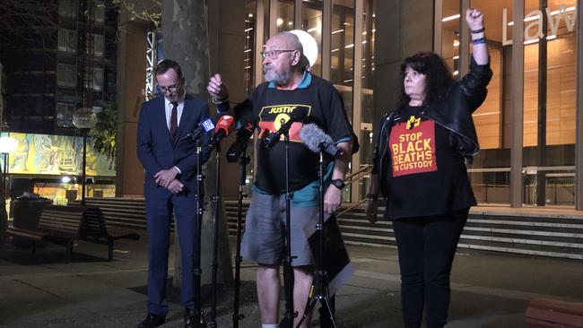 Greens MP David Shoebridge stands in the background while protest organiser Raul Bassi declares the Black Lives Matter rally will go ahead. Picture: Angelica Snowden