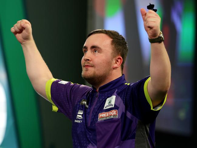 LONDON, ENGLAND - DECEMBER 30: Luke Littler of England celebrates winning his round four match against Raymond van Barneveld of Netherlands on day 13 of the 2023/24 Paddy Power World Darts Championship at Alexandra Palace on December 30, 2023 in London, England. (Photo by Tom Dulat/Getty Images)