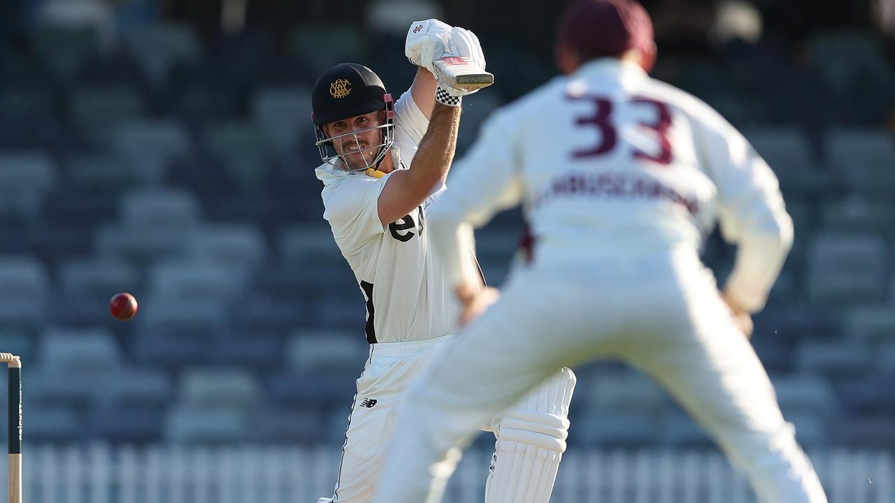 Mitch Marsh drives a ball past Queensland captain Marnus Labuschagne at cover on his way to 94 for Western Australia at the WACA. Picture: Paul Kane / Getty Images