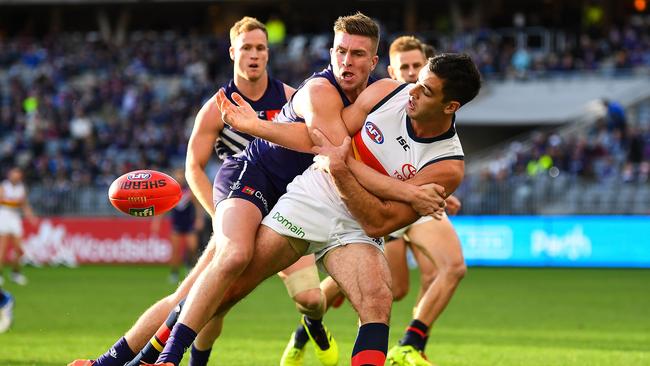 Docker Luke Ryan wraps up Crows skipper Taylor Walker. Picture: Daniel Carson/AFL Media/Getty Images