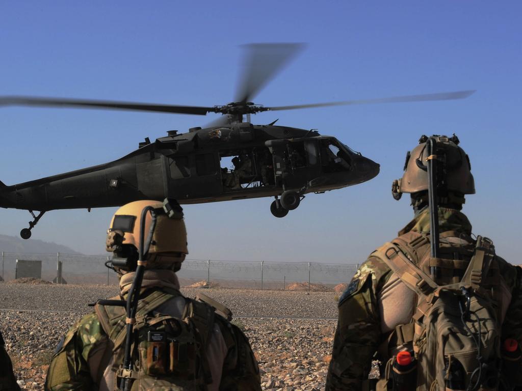 Special Operations Task Group (SOTG) soldiers wait to board the next UH-60 Black Hawk helicopter. Picture: Department of Defence