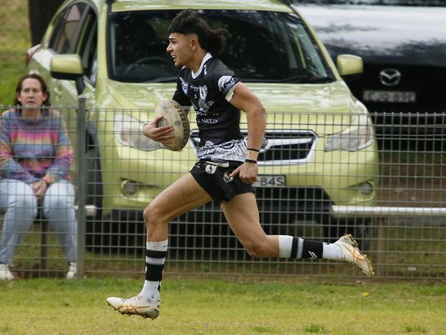 Too fast: Kobe Tooala races away to score on debut. Picture Warren Gannon Photography