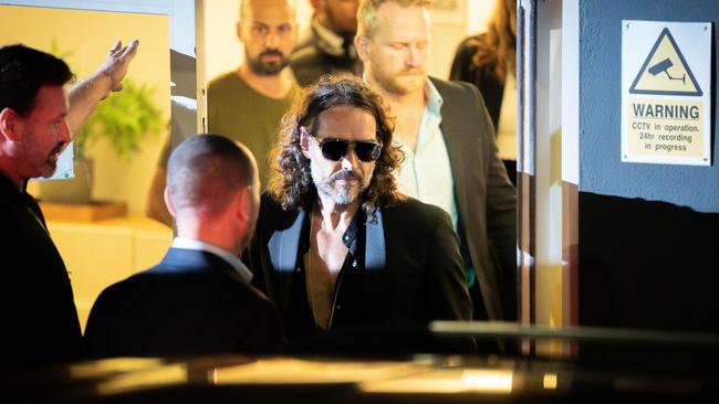 Russell Brand leaves the Troubabour Wembley Park theatre in north-west London after performing a comedy set. Picture: PA via Getty Images.