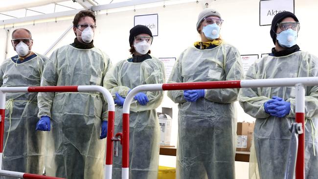 Medical employees wait to carry out tests at a coronavirus test centre in Germany. Picture: AFP.