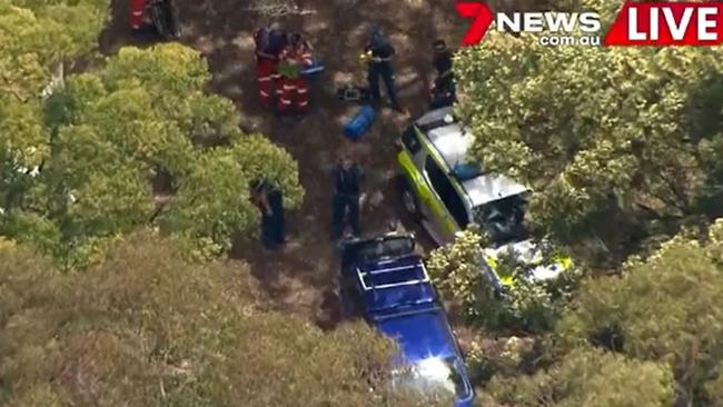 Emergency crews at the scene in Springbook National Park where a man fell about 50 metres from a cliff. Picture: 7News