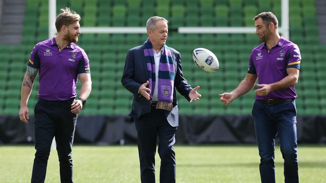 Labour leader Bill Shorten (C) with a couple of handy footballers. Picture: Michael Klein