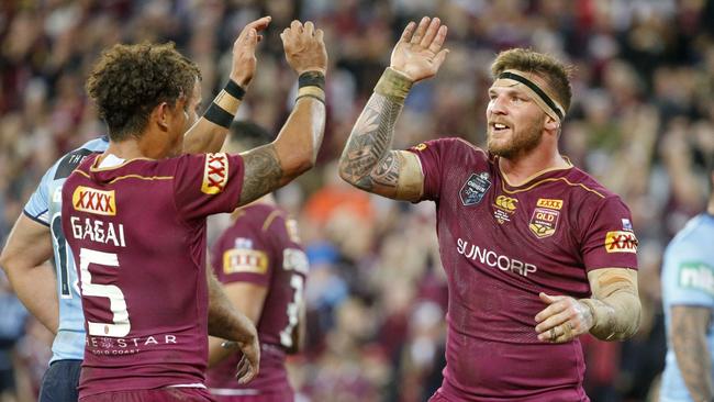 Dane Gagai and Josh McGuire celebrate the Maroons’ victory.