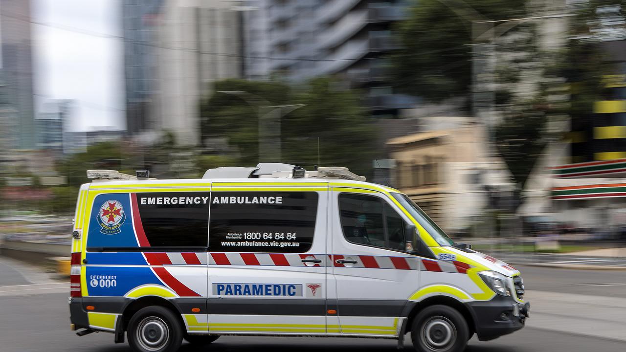 MELBOURNE, AUSTRALIA - NewsWire Photos FEBRUARY 13, 2022: An ambulance speeds away from the Royal Melbourne Hospital. Ambulance, Generic. Picture: NCA NewsWire / David Geraghty