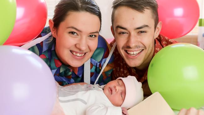 LONG ODDS: Astrid Myers and Chris Henley, both born on July 10, with new baby girl Winter, who shares their birth date. Picture: RUSSELL MILLARD