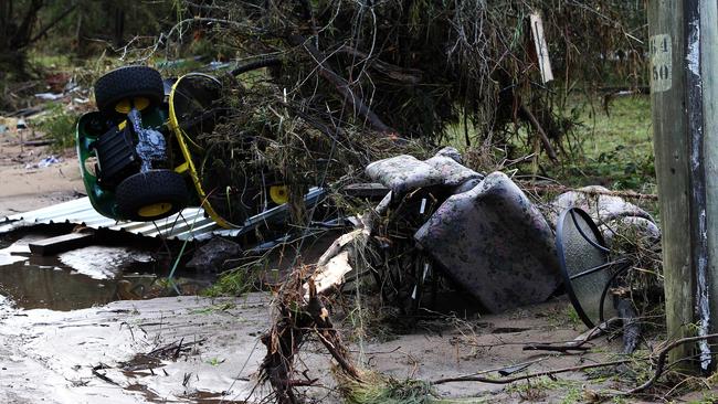 Household items near Mary Allford's home where she died during flooding at Shale Road, Latrobe PICTURE: CHRIS KIDD