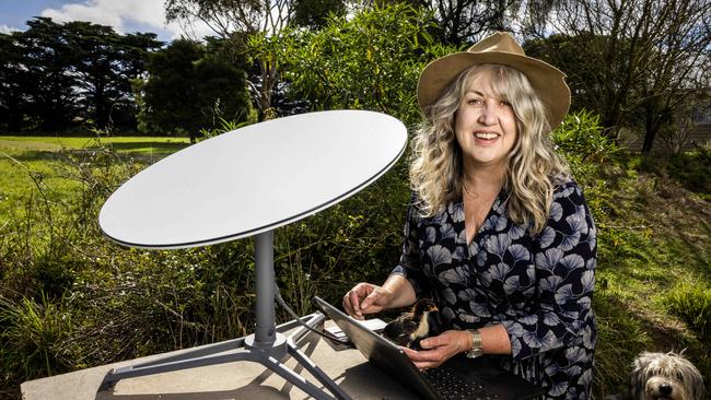 Tristia Lakey with her Starlink satellite on her livestock property at Sunbury. Picture: Nicole Cleary