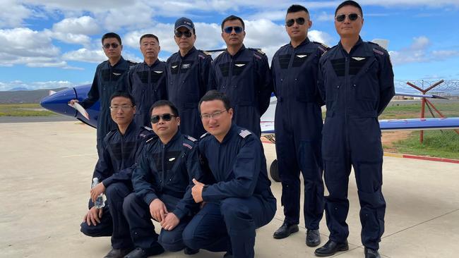 Test Flying Academy of South Africa has been implicated in Beijing's bold scheme to poach Australian and British pilots to train Chinese armed forces. Images from TFASA show a group of prospective pilots "nearing course completion" at an undisclosed location. Picture: TFASA/Facebook