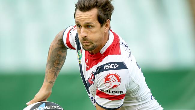Mitchell Pearce runs the ball at a Roosters training session.