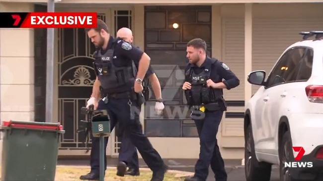 Police officers at one of the homes targeted during crime spree. Picture: 7NEWS