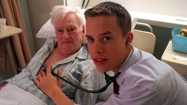 Peter van Wijngaarden as a first-year intern at the Monash Medical Centre with a patient in 2000. Picture: Alan Funnell.