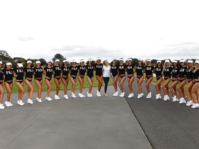 Miss Supercars Ambassador Katie Stevens (white, centre) with the Miss Supercars 2017 finalists at Norwell Motorplex on the Gold Coast this week, October 2017