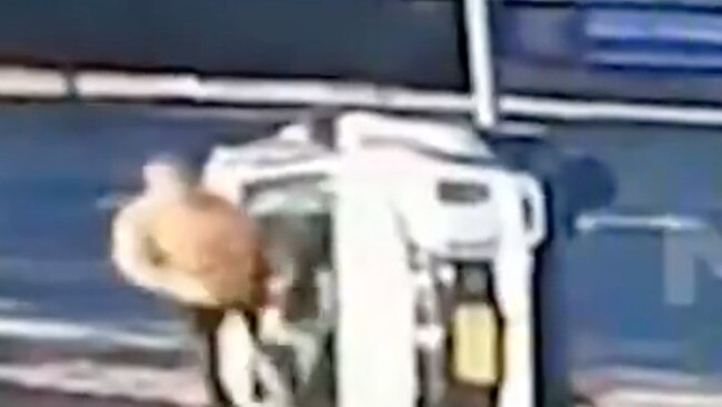 7NEWS has obtained dramatic video of the moment a cut his way from a wrecked car using an axe. Picture: 7NEWS